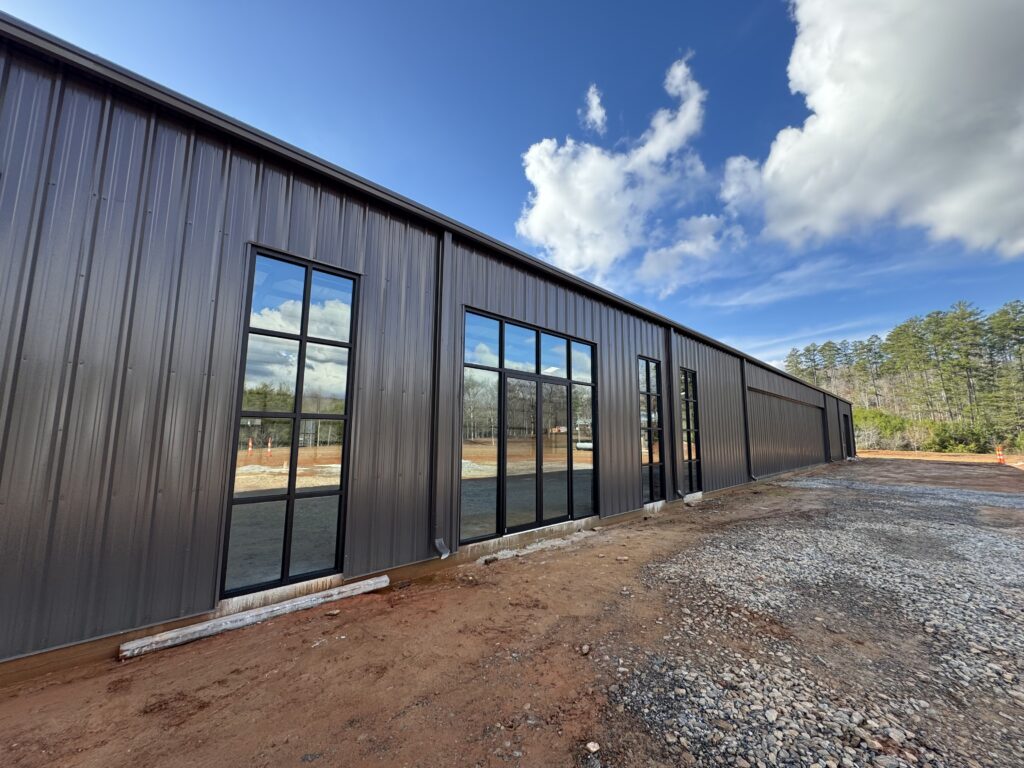 Exterior view of storefront windows of Big Creek Distillery