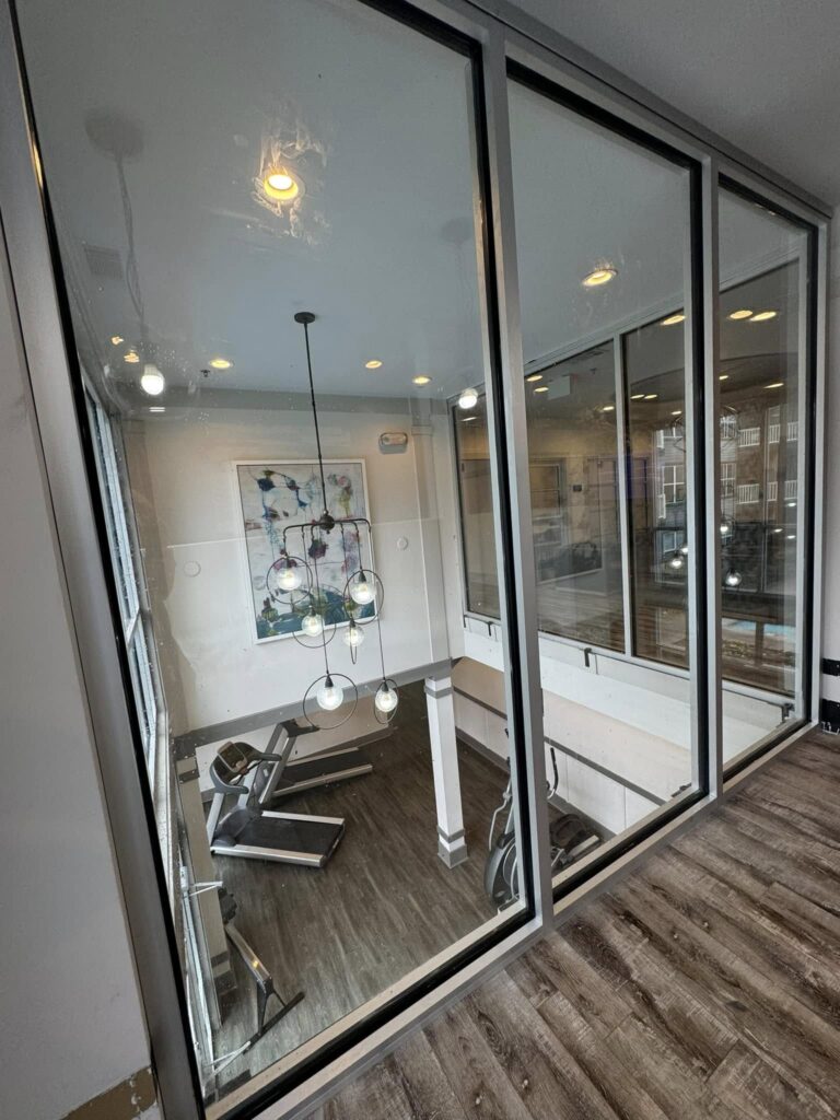 Interior glass partition surrounding an office