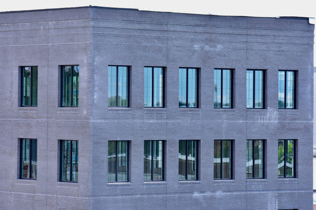 Closeup of the upper story exterior windows on the Bradford Building in downtown Gainesville, after installation.